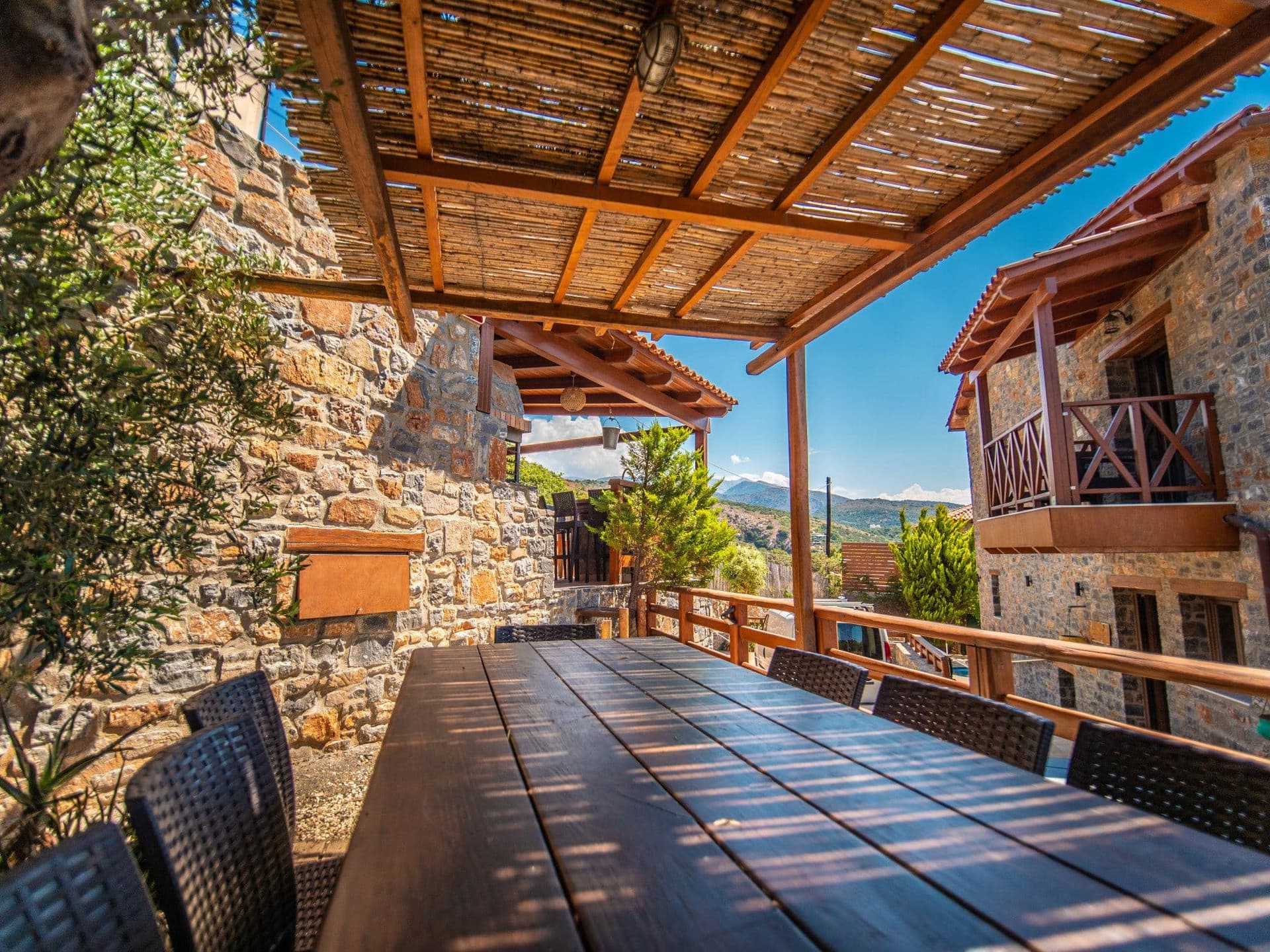 Villa terrace with stone architecture and mountain views