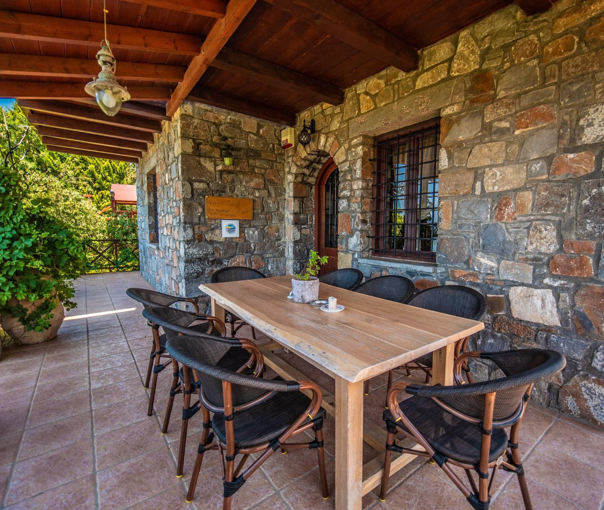Outdoor dining area with stone architecture