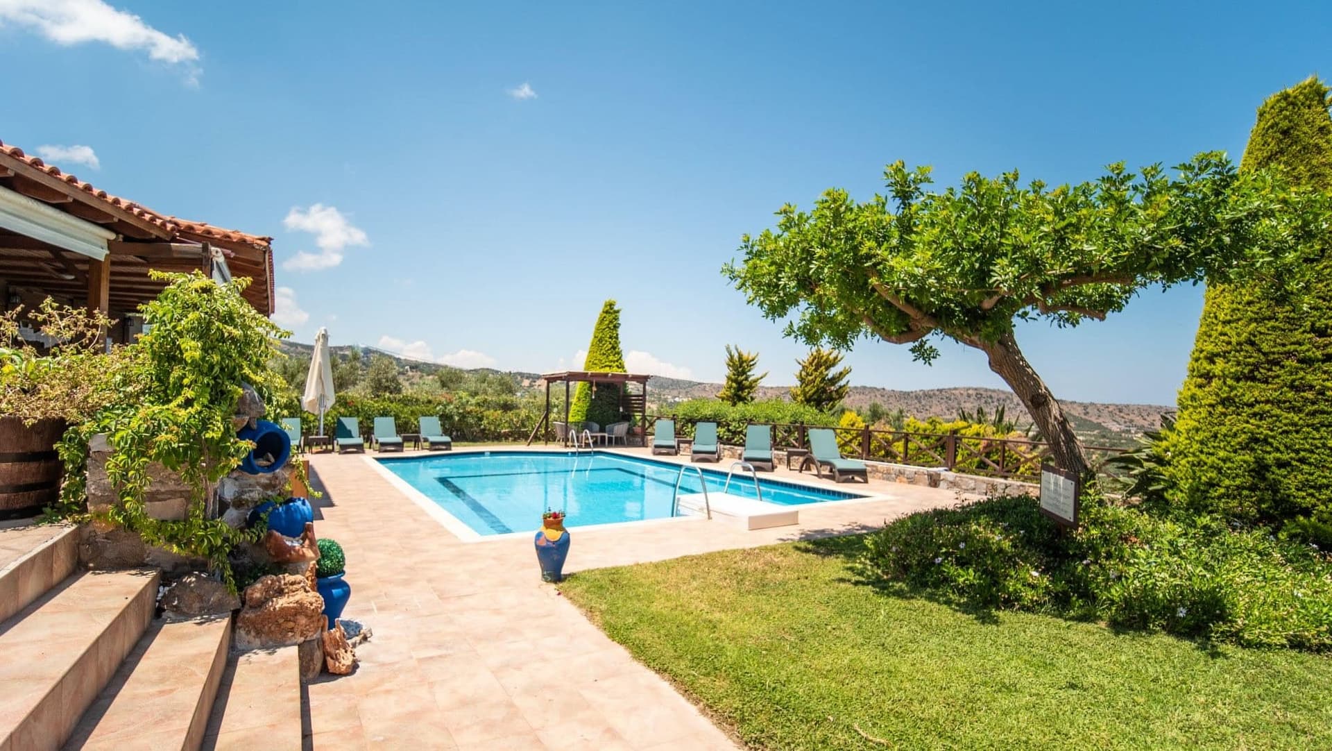 Gaia villa pool and garden daytime